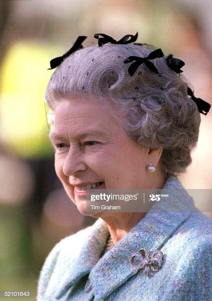 Queen Elizabeth wears a black veil with velvet bows